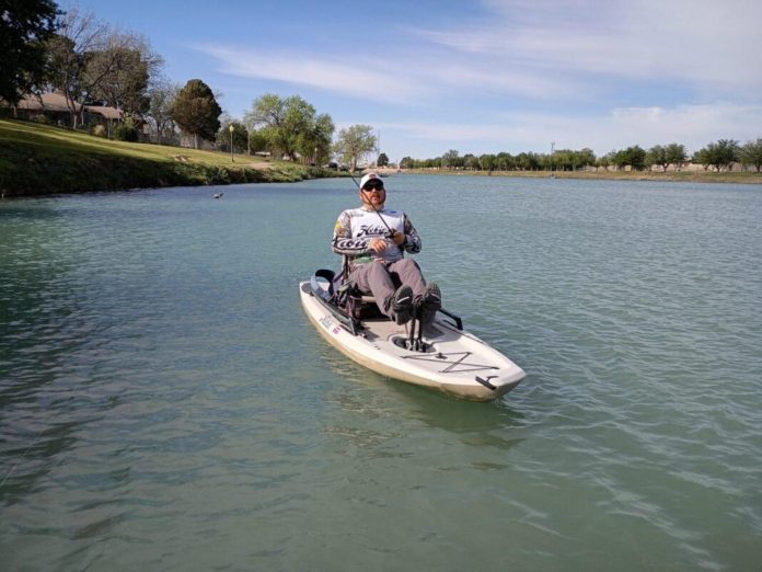 Matt Ramey pedals a kayak while fishing along the Pecos River in Carlsbad on April 2, 2026.