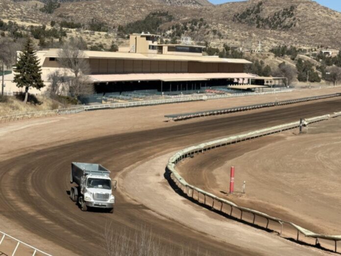 A truck drives through Ruidoso Downs Race Track on Jan. 20, 2026, the day after horse racing was canceled at the track for the 2026 season due to flood damage. The Triple Crown Series will now move to Texas in 2027.