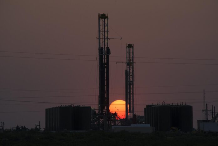 Oil and gas drilling rigs operate in the Permian Basin